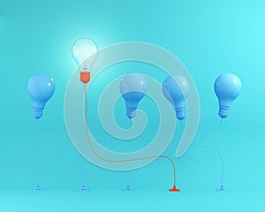 Outstanding red light bulbs with glowing in air one different idea from light bulbs the others on blue pastel background,Minimal