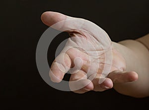 Outstretched hand on a dark background