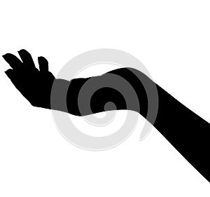 Outstretched left woman`s hand from the side with palm up. silhouette photo