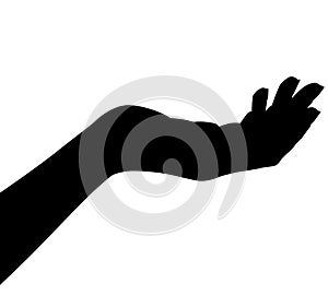 Outstretched right woman`s hand from the side with palm up. silhouette photo
