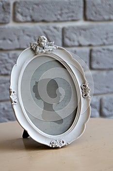 Oval ancient frame with angel for your picture, photo