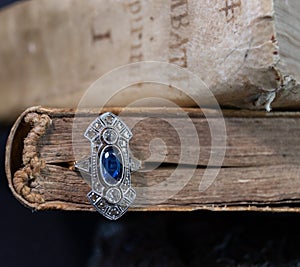 Oval blue ring inside an old book