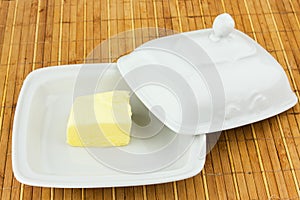 Oval dish with the oil cap on a bamboo napkin