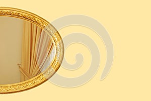 Oval empty wooden and gold gilded frame