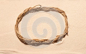 Oval frame of rope on sand