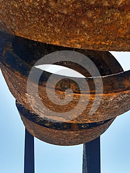 Oval iron structure on blue sky background. Architecture and construction. Construction materials