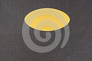 Oval label with texture on .anthracite fabric background