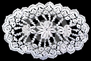 Oval lace tablecloth isolated on black background
