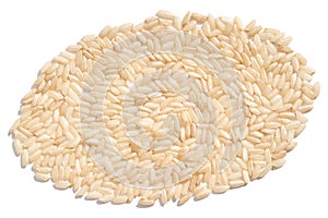 An oval of raw brown and white rice, forming a pile on an isolated background.