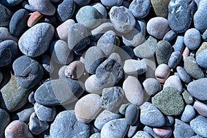 Oval sea-cut stones pebbles of different sizes create a natural texture