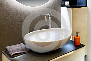 Oval washbasin located in bathroom