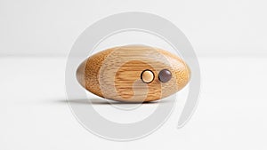 The object rests on a flat white surface set against a plain white background