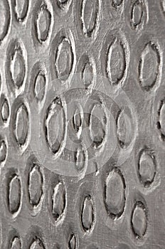 Ovals pressed into white paint and dried, side view