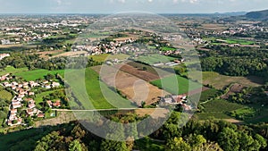 OVARO MIONE, ITALY - APRIL, 2023: Aerial drone view of a valley in the morning with clouds. Small mauntain village Mione