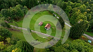 OVARO MIONE, ITALY - APRIL, 2023: Aerial drone view of a valley in the morning with clouds. Small mauntain village Mione