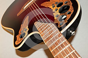 Ovation acoustic guitar in red product shot