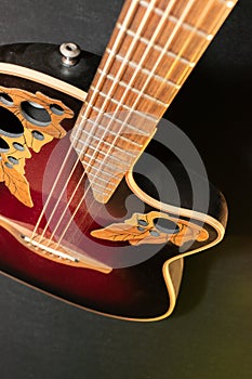 Ovation acoustic guitar in red product shot