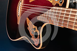 Ovation acoustic guitar in red product shot