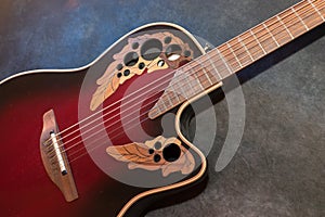 Ovation acoustic guitar in red product shot