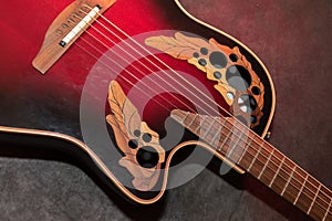 Ovation acoustic guitar in red product shot