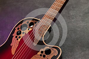 Ovation acoustic guitar in red product shot