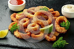 Oven baked breaded calamari rings served with lime wedges, sweet chilli sauce and mayonnaise