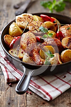 Oven-baked chicken with vegetables and herbs