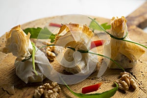 Oven-baked filo pastry vegetable packets.