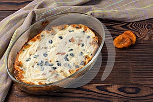 Oven baked homemade curd casserole with raisins and dried apricots