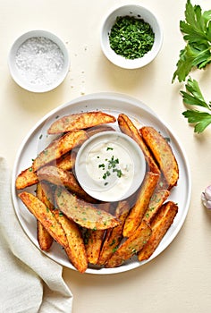 Oven baked potato wedges with sauce