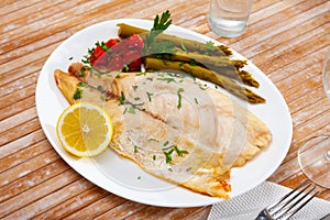 Oven baked rooster fish with marinated asparagus