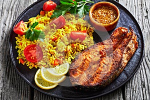 Oven baked salmon steak with yellow rice