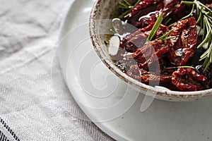Oven dried tomatoes close up in a bowl