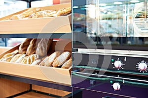 Oven and loaves of bread on shelf