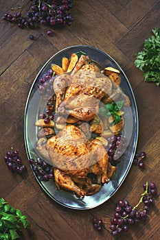 Oven roasted chicken served with baked potato