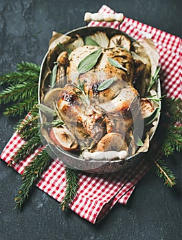 Oven roasted whole chicken in tray with Christmas table decotarion photo