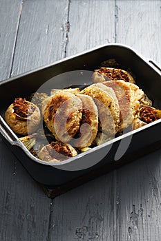 Oven tray with cordon bleu cutlets