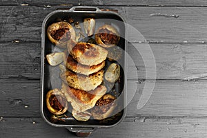 Oven tray with cutlets above view