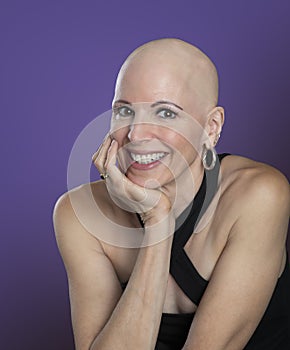 Over 50 woman with alopecia and a big smile