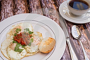 Over-easy eggs with fresh slasa and coffee