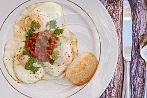 Over-easy eggs with fresh slasa and coffee