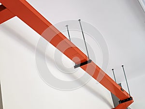 Over head orange color cable tray or trunking mount on concrete ceiling.