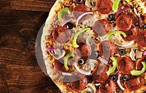 Over head view of pizza with supreme toppings photo