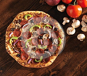 Over head view of pizza with supreme toppings photo