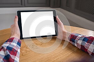 Mockup image of digital tablet computer with white blank screen in man hands