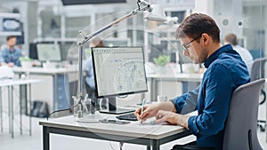 Over the Shoulder Shot of Engineer Working with CAD Software on Desktop Computer, Screen Shows Tec