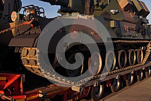 Over-standard, atypical road transport. A howitzer on the tank chassis photo