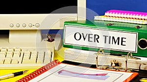 Over time-a text label on the office Registrar folder. photo