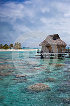 Over-water bungalow luxury in tropical lagoon