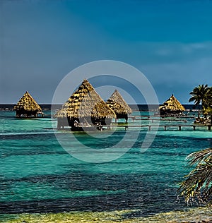 The over-water bungalows in Glover`s Atoll, Belize